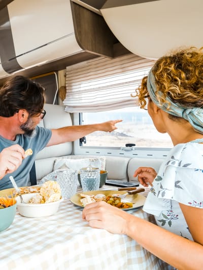 a-happy-couple-spending-time-together-having-fun-dinner-in-an-rv